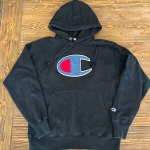 Champion reverse weave hoodie in black with letterman style big C.